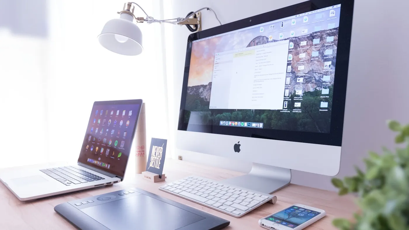 Mobile phone and laptop used to review small business website experience